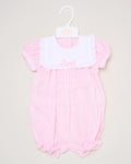 The Baby Girls Smocked Romper features pink and white stripes, short puff sleeves, a white ruffled collar, and a small front bow. It is shown on a white hanger against a plain background.