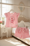 Pink cupcake outfit with both pieces on hangers